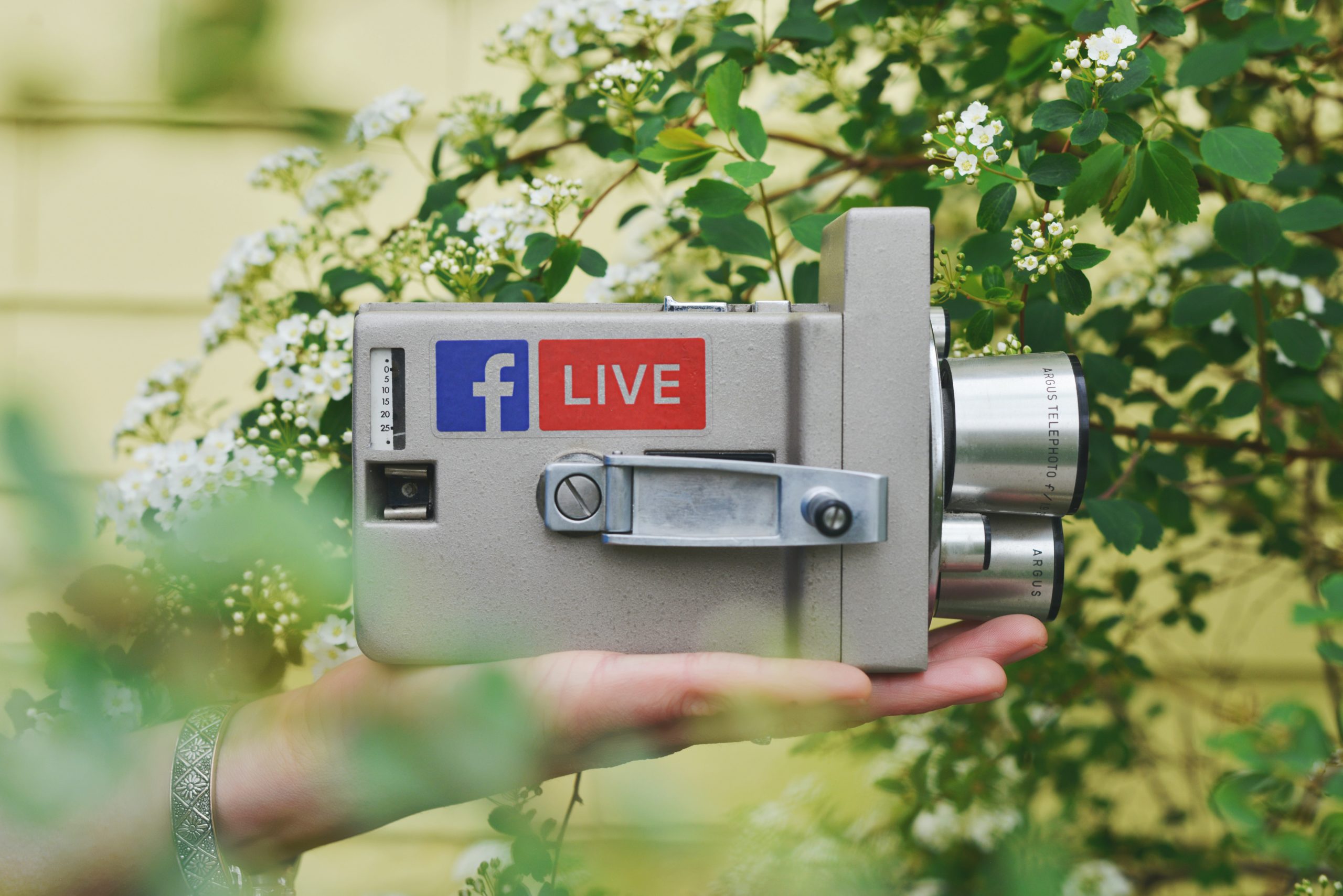 A camera with a Facebook Live sticker on the side.