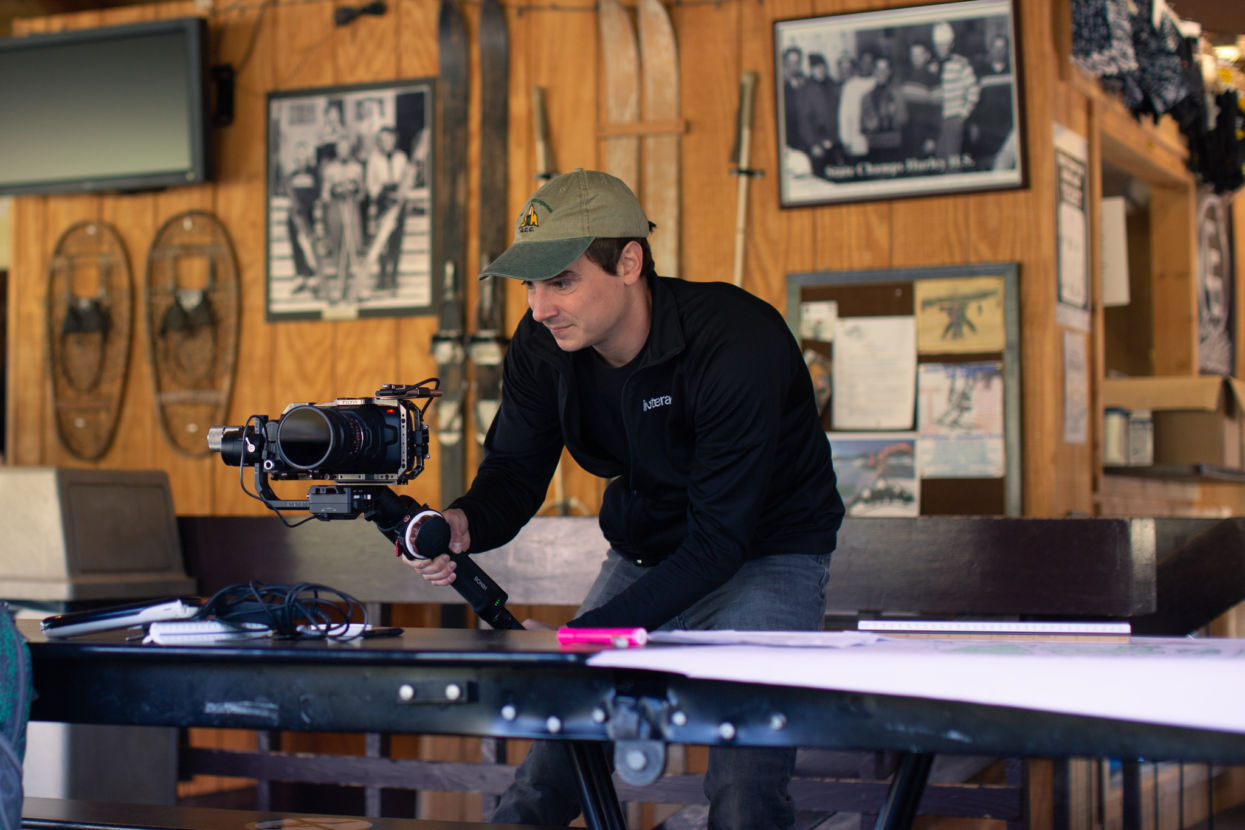 Jake Ammann using professional camera at a video shoot