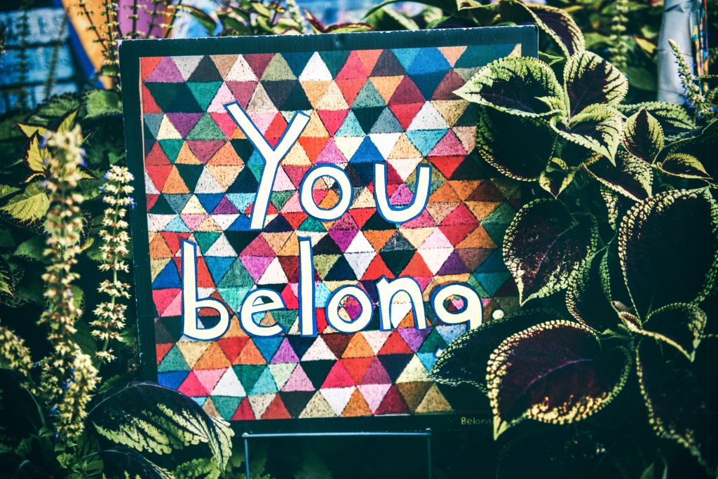 A sign says "You belong."