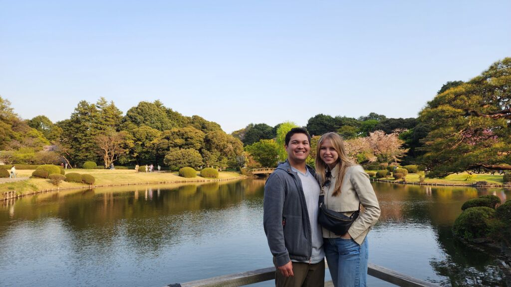 Alana is pictured with her partner in front of Tokyo's famous cherry blossoms.
